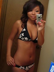 Hot asian teen posing in front of the mirror